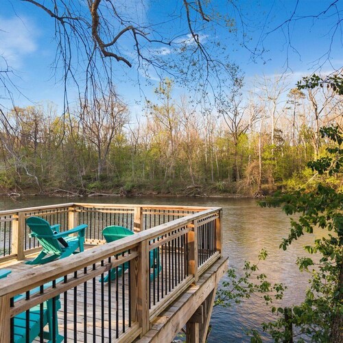 Spacious 9-bedroom waterfront retreat on over 2 private acres with above-ground pool, firepit, gazebo right on Shenandoah River, Theater Room, and detached garage with second kitchen and pool table.