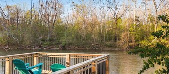 Spacious 9-bedroom waterfront retreat on over 2 private acres with above-ground pool, firepit, gazebo right on Shenandoah River, Theater Room, and detached garage with second kitchen and pool table.