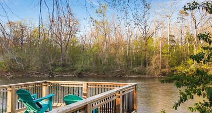 Spacious 9-bedroom waterfront retreat on over 2 private acres with above-ground pool, firepit, gazebo right on Shenandoah River, Theater Room, and detached garage with second kitchen and pool table.