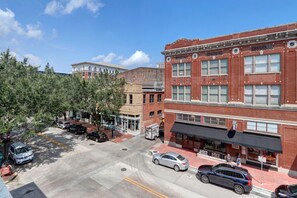 Stroll through a vibrant commercial area with a mix of architectural styles.