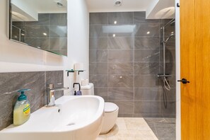 Bathtub, hair dryer, towels