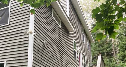 Nestled between Bar Harbor and Acadia, a bright and spacious house in the woods