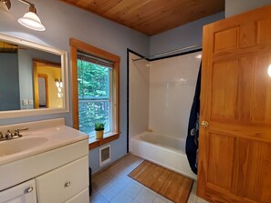 Combined shower/tub, hair dryer, towels, soap