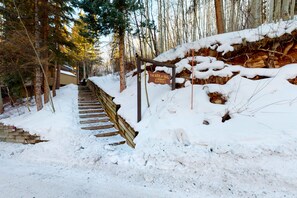 Stroll up the snow-covered staircase to The Ark at Vail J. Hobart, nestled among the trees at 6255 ft.