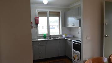 Microwave, cookware/dishes/utensils, dining tables