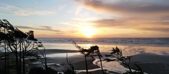 Enjoy the beach, ocean and sunsets no matter the weather.