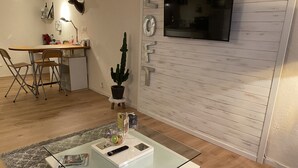Comfort Apartment, 1 Queen Bed | Living area | 120-cm TV with digital channels - ESCAPADE (Violaines)