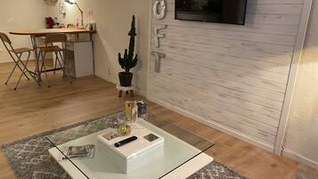 Comfort Apartment, 1 Queen Bed | Living area | 120-cm TV with digital channels