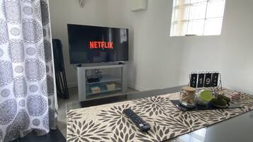 Comfort Apartment, 2 Queen Beds | Living area | 120-cm TV with digital channels