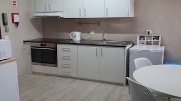 Coffee/tea maker, fridge, microwave, oven