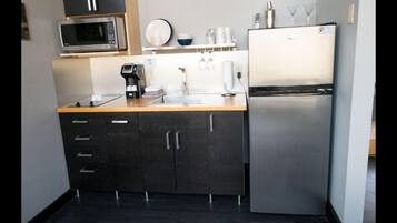 Microwave, stovetop, coffee/tea maker, cookware/dishes/utensils