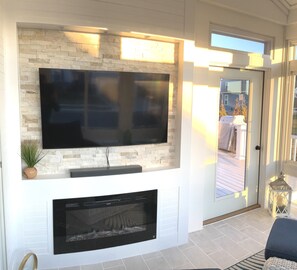 Smart TV, fireplace, DVD player, books