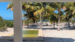A beach view with palm trees and a pool. - SanCrisanto House (San Crisanto)