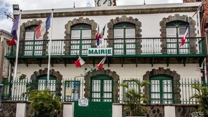 A building with a sign reading "MAIRIE" and multiple flags. - Studio for rent (Case-pilote)