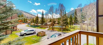 Walk to the Ski Shuttle Bright Condo w/ Fireplace & Shared Hot Tub/Pool