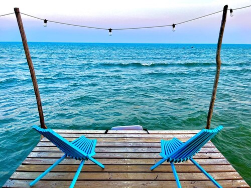 Beachfront surrounded by lush natural jungle. Snorkle from shore manatee watch 