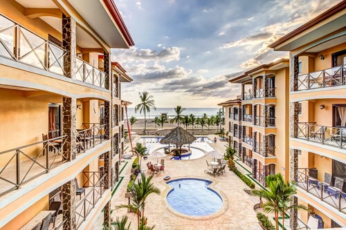 Deluxe, Beachfront Apartment w/ Shared Pools, Free WiFi, & Central A/C
