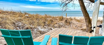 Fully-renovated lakefront home with beach cabana, association beach, & firepit
