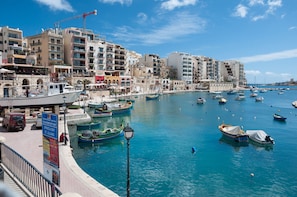St. Julians waterfront offers stunning views of the marina and surrounding buildings with balconies.