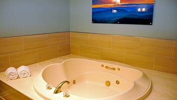 Bathtub, jetted tub, towels, soap