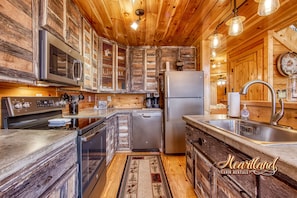Enjoy cooking in this kitchen with oven, dishwasher, and modern appliances.