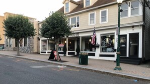 A two-story building with a 'For Rent' sign, a barber shop sign, and a closed shop sign. - Fun Downtown Location 2nd flr (Southington)