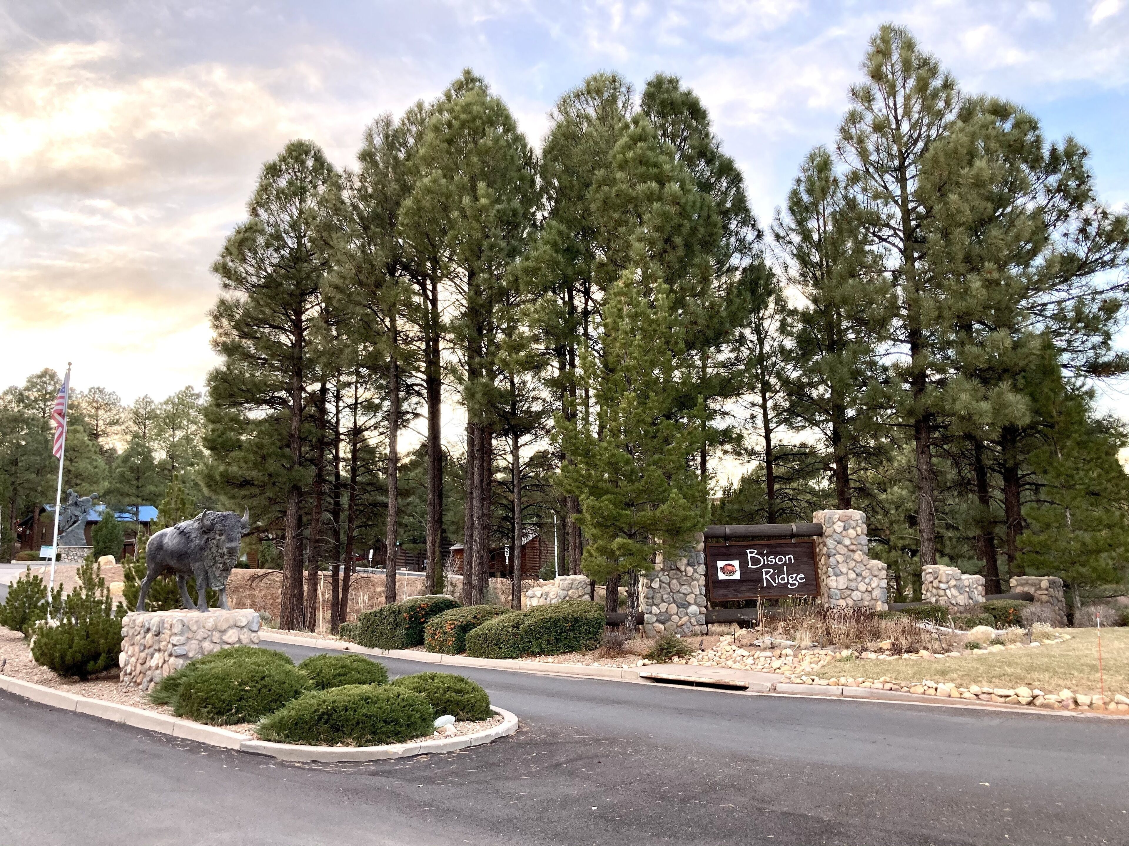 A stone building with a sign reading "Bison Ridge."