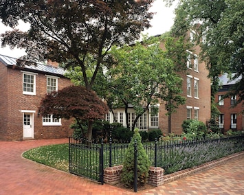 View of side garden and driveway, with parking for up to 5 cars.