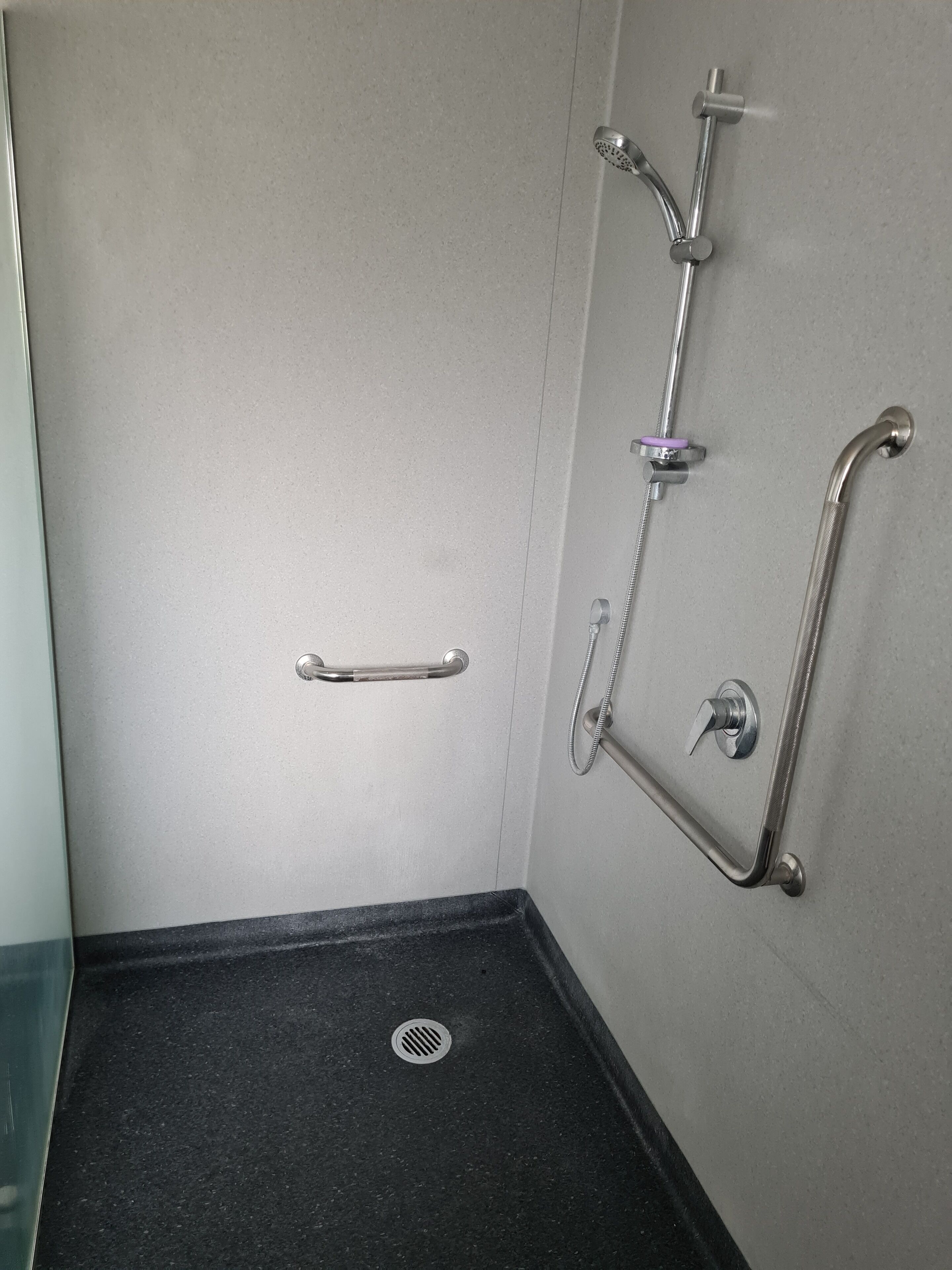 Shower, hair dryer, towels, toilet paper