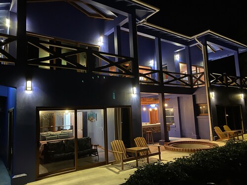 Modern Spanish beach house, with private bar and guest rooms.