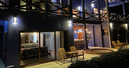 Modern Spanish beach house, with private bar and guest rooms.