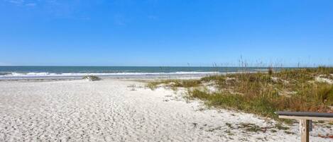 On the beach, sun loungers, beach towels