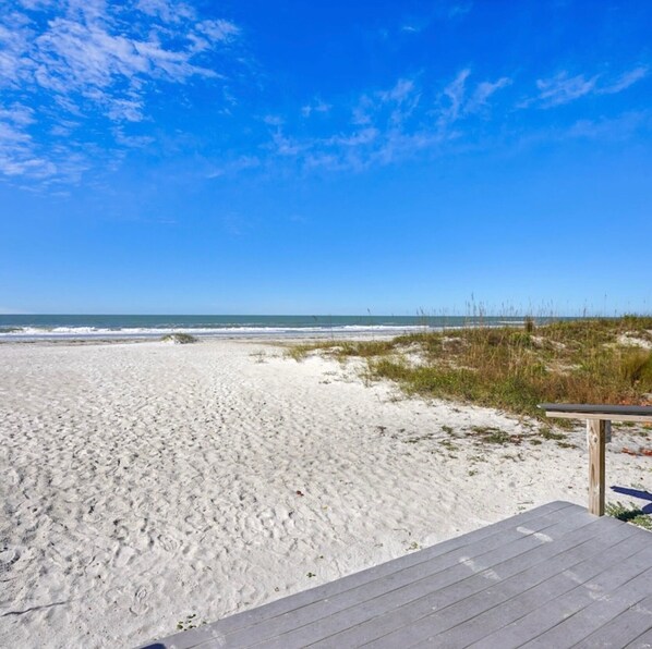 On the beach, sun loungers, beach towels