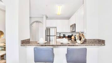 Coffee/tea maker, fridge, microwave, oven