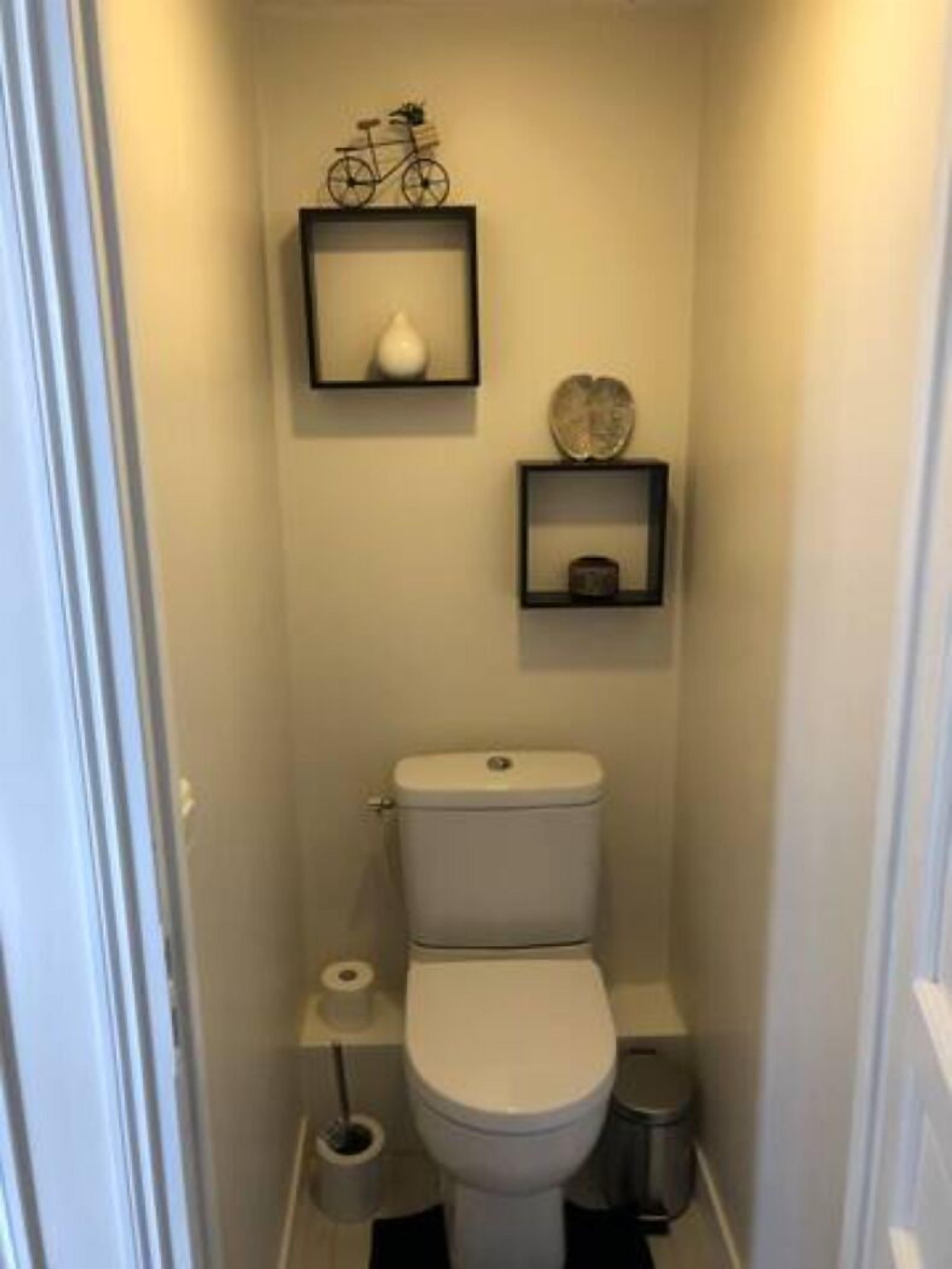 Bathtub, towels, soap, toilet paper