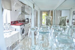 Fridge, microwave, stovetop, coffee/tea maker