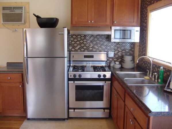 Microwave, coffee/tea maker, cookware/dishes/utensils, spices