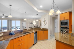 Enjoy cooking in this well-equipped kitchen with a central island, ample counter space, and appliances.