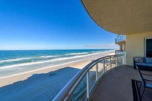A balcony with a view of a beach and ocean. - High End Lux Condo With Oceanfront Massive Balcony (Daytona Beach)