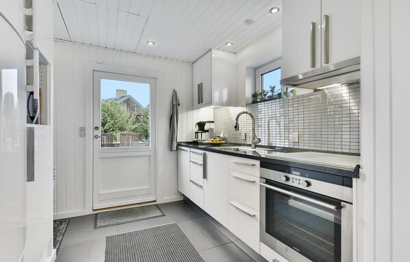 Fridge, oven, coffee/tea maker, cookware/dishes/utensils
