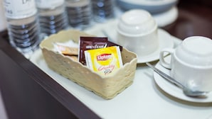 A tray with Lipton black tea, a cup, and a spoon on a table. - D&f BOUTIQUE HOTEL SENAWANG (Seremban)