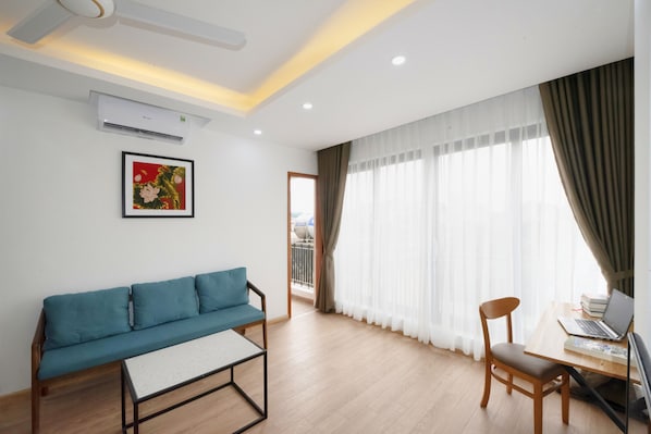 Deluxe Apartment | Living area | Smart TV
