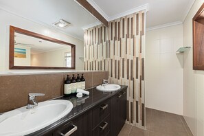 Bathtub, hair dryer, towels, soap