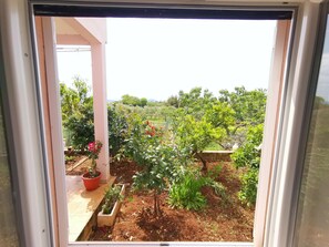 Enjoy a serene view of the lush garden from the comfort of your room.