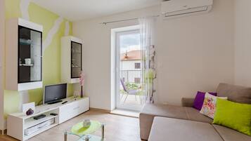 Apartment (One Bedroom Apartment) | Living room | Flat-screen TV