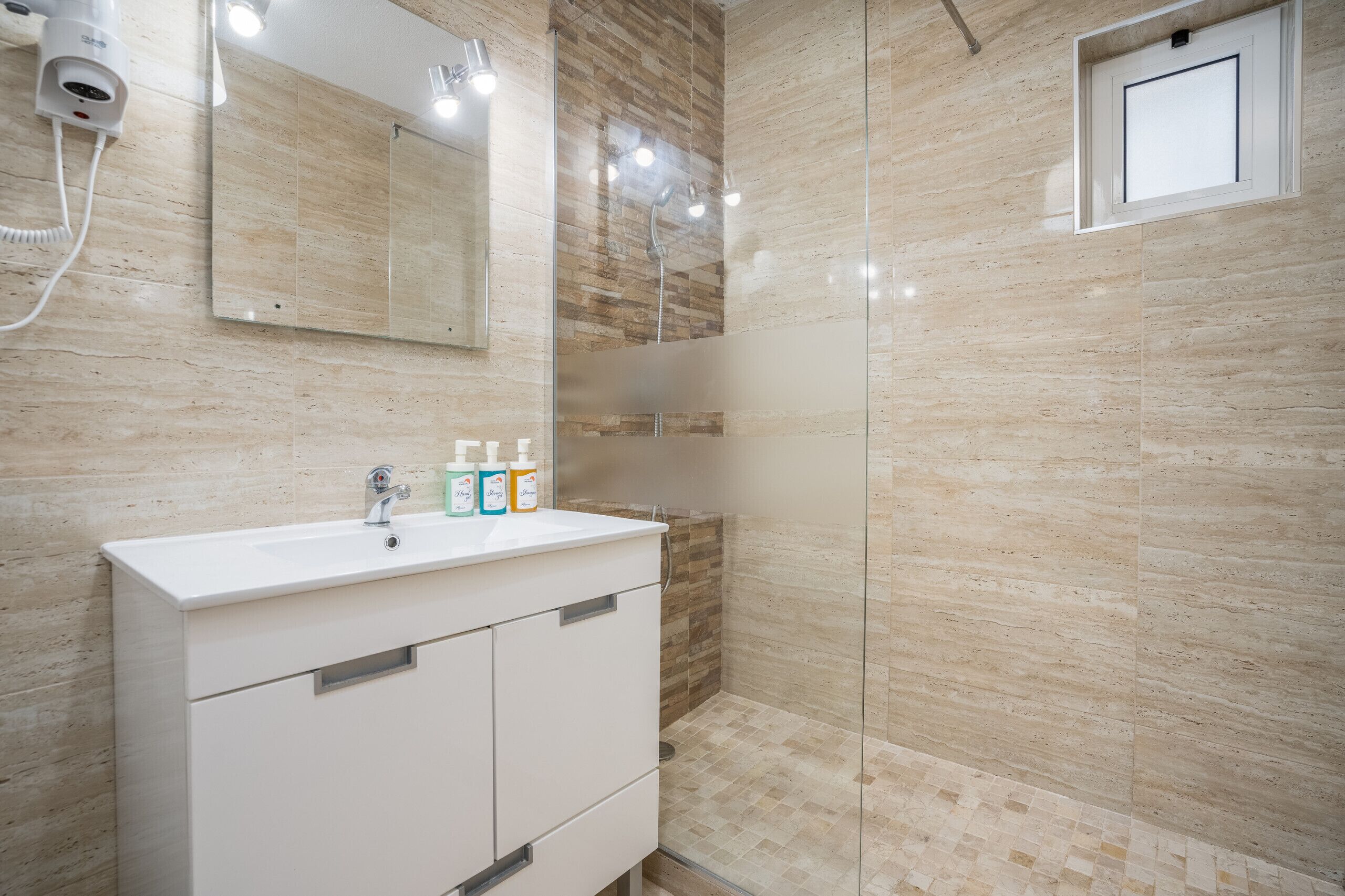 Shower, hair dryer, soap, shampoo