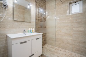 Shower, hair dryer, soap, shampoo