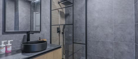 Bathtub, hair dryer, soap, shampoo