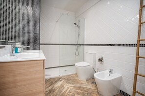 Bathtub, hair dryer, soap, shampoo