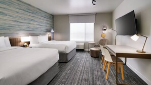 A hotel room with two beds, a desk, a chair, a TV, and a window. - TownePlace Suites by Marriott Salt Lake City Murray (Murray)